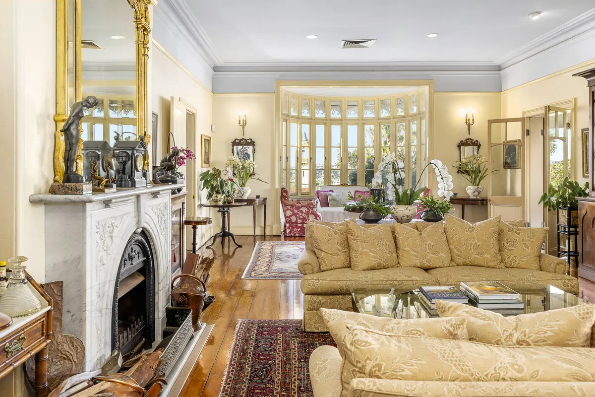 Decorative fireplace and detailed ceiling in a Bowen Hills period residence